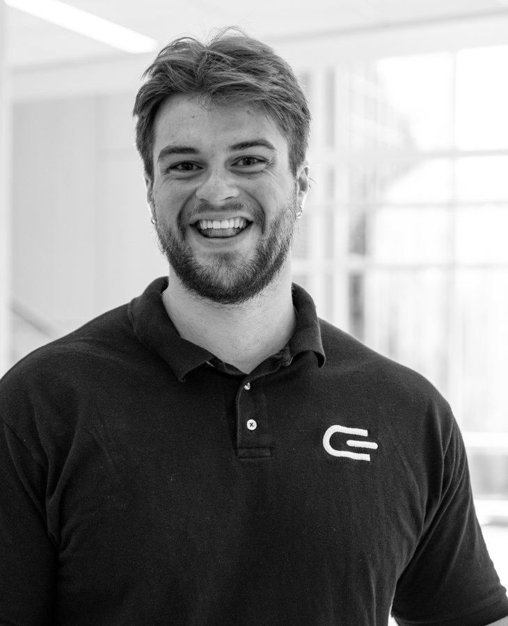 Gabe Allen, founder of Given, smiling in a polo with the Given mark